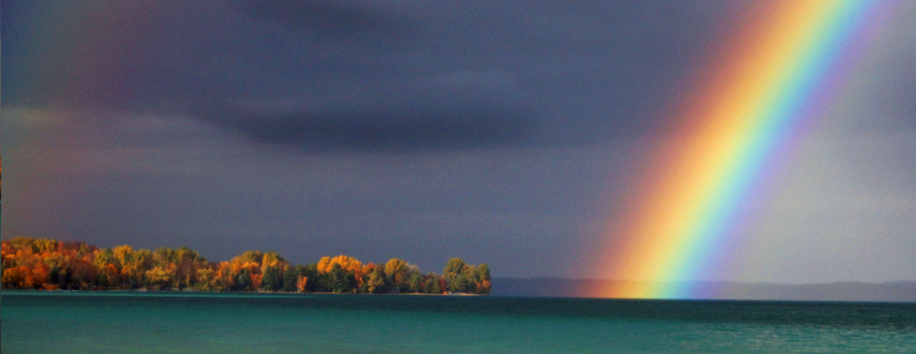 Rainbow over Torch Lake by John Peal